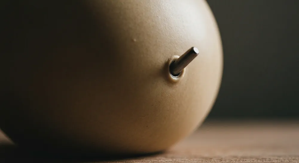 Abstract waves representing diplomatic discussions, with a backdrop of oil barrels and cargo ships, symbolizing trade tensions.