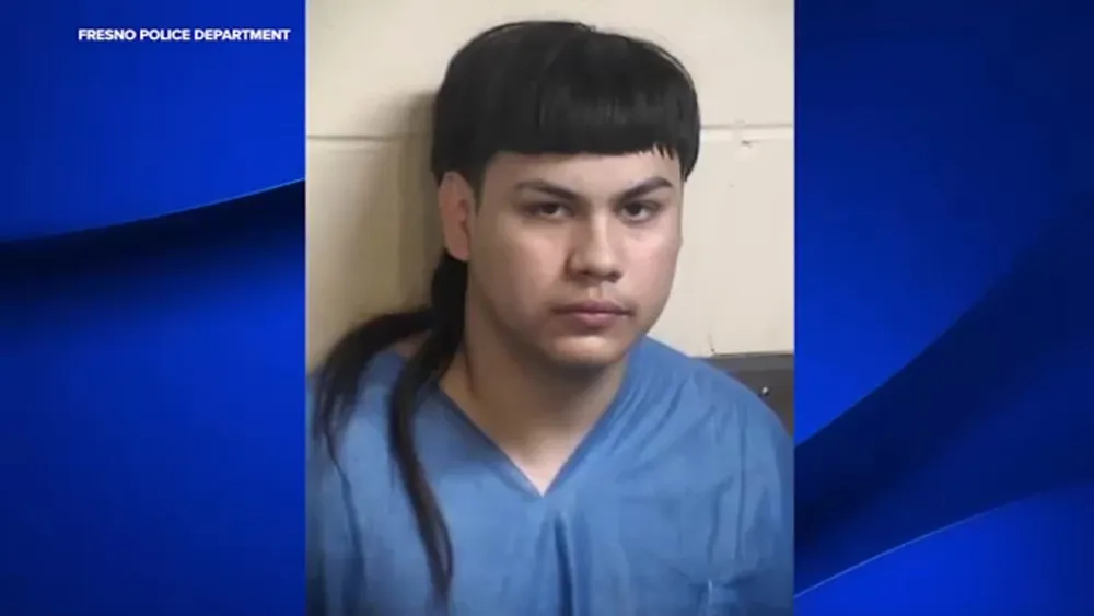 Fresno police release video of officer striking armed suspect with patrol car