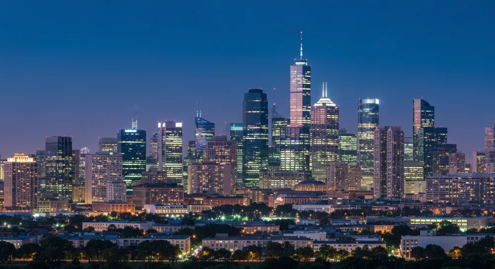 Skyline with financial district and abstract growth arrows.