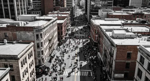 A smoke-filled hallway with emergency exit signs illuminating the path.
